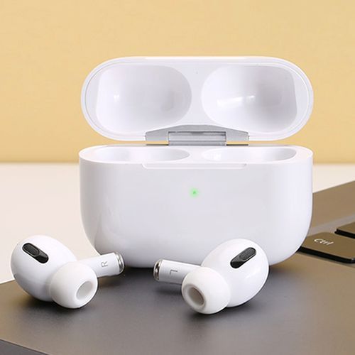 White wireless earbuds with charging case on a light background